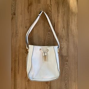 White purse with gold accents